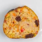 A slice of Embutido (Filipino Meatloaf) on a plate.