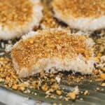 Palitaw sweet rice cakes on a plate with banana leaf.