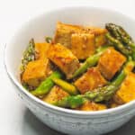 Stir Fried Tofu and Asparagus in a bowl.