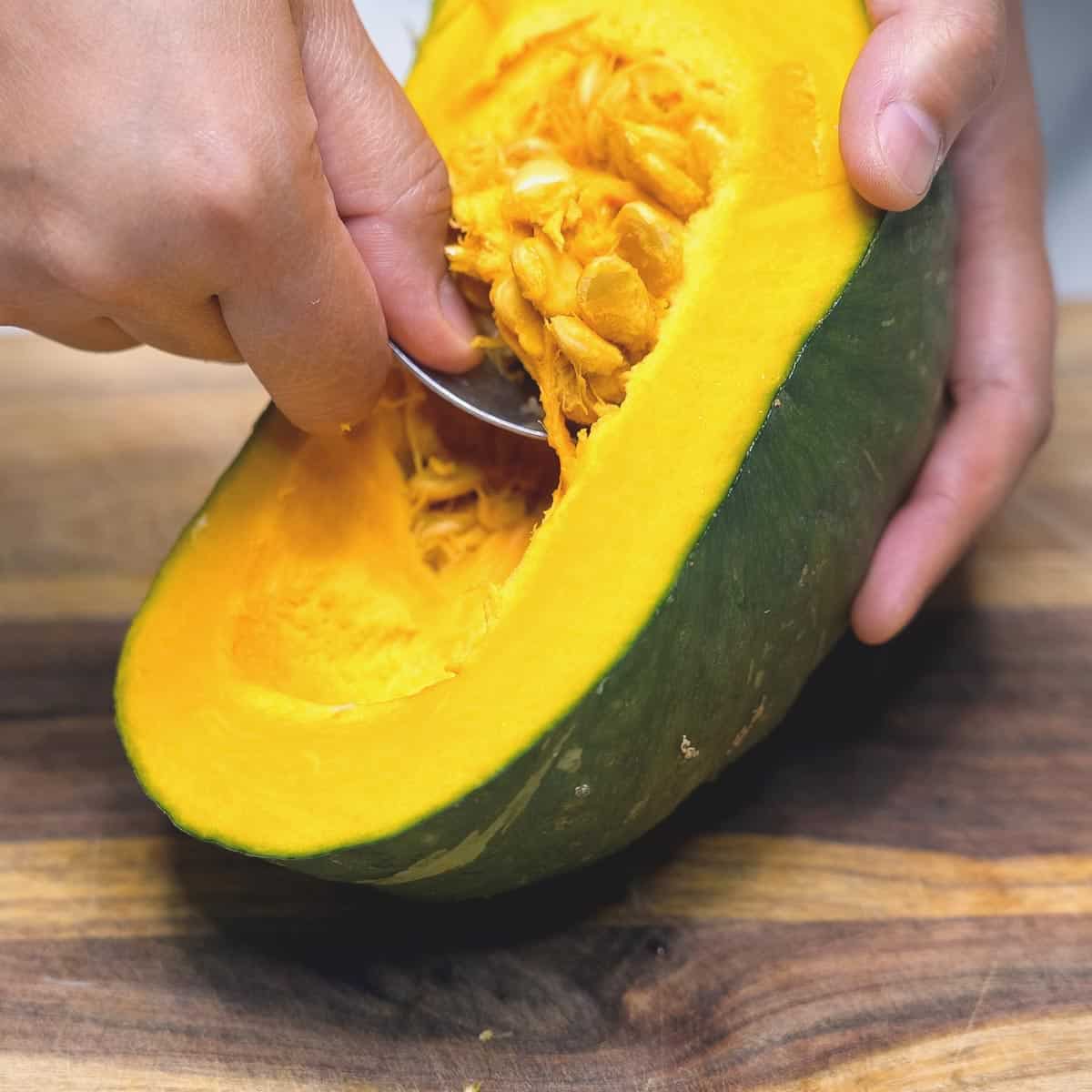 scooping out the seeds with a spoon.