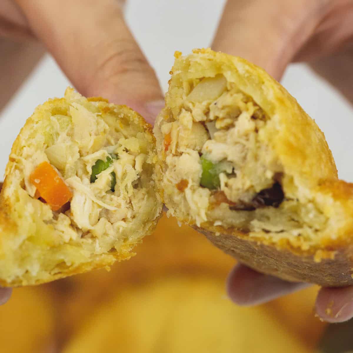 Breaking up a chicken empanada.