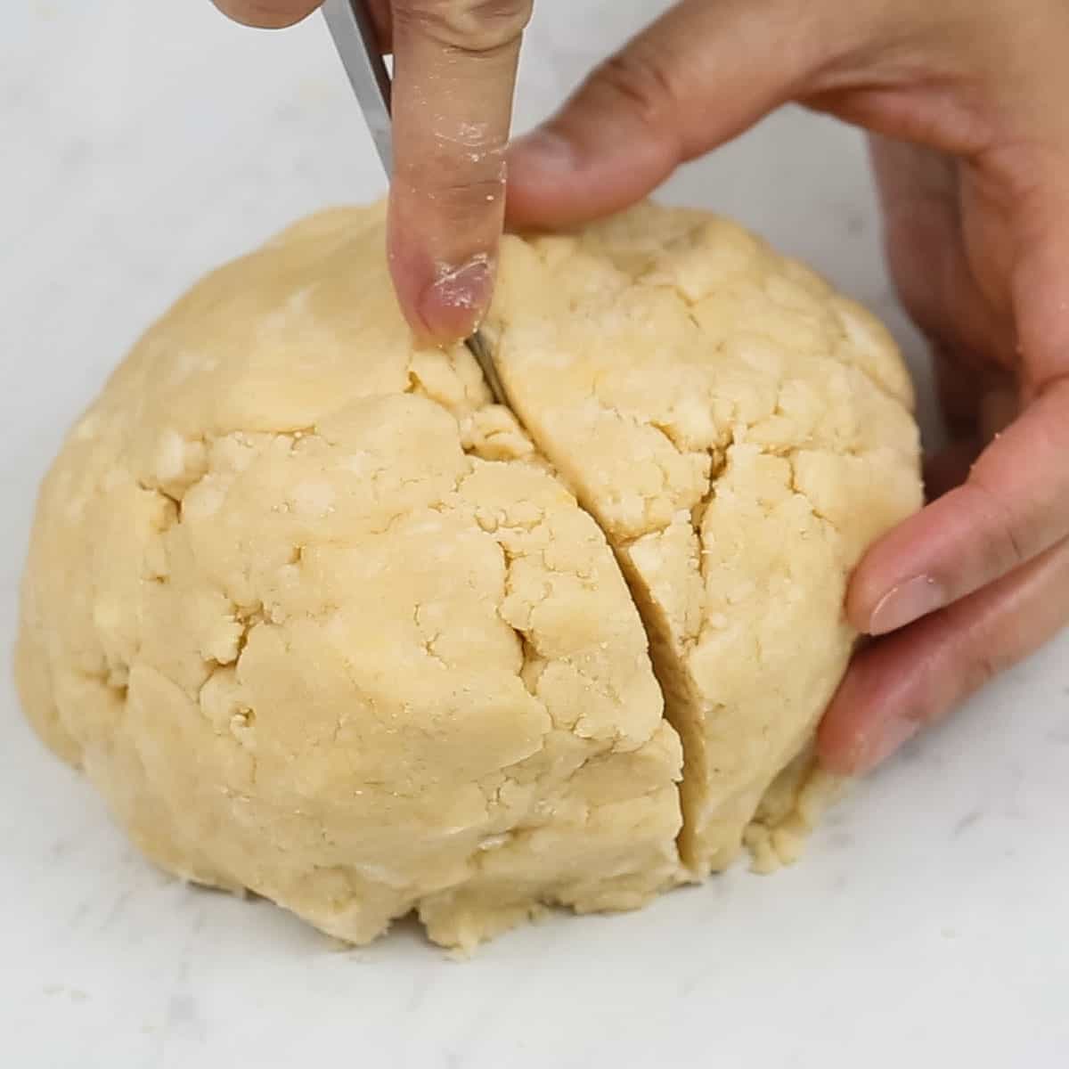 Dividing the dough in half.