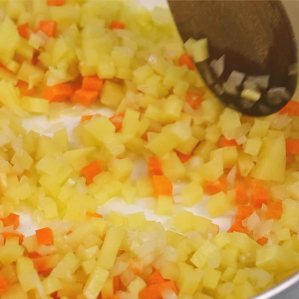 Potatoes and carrots in the pan.