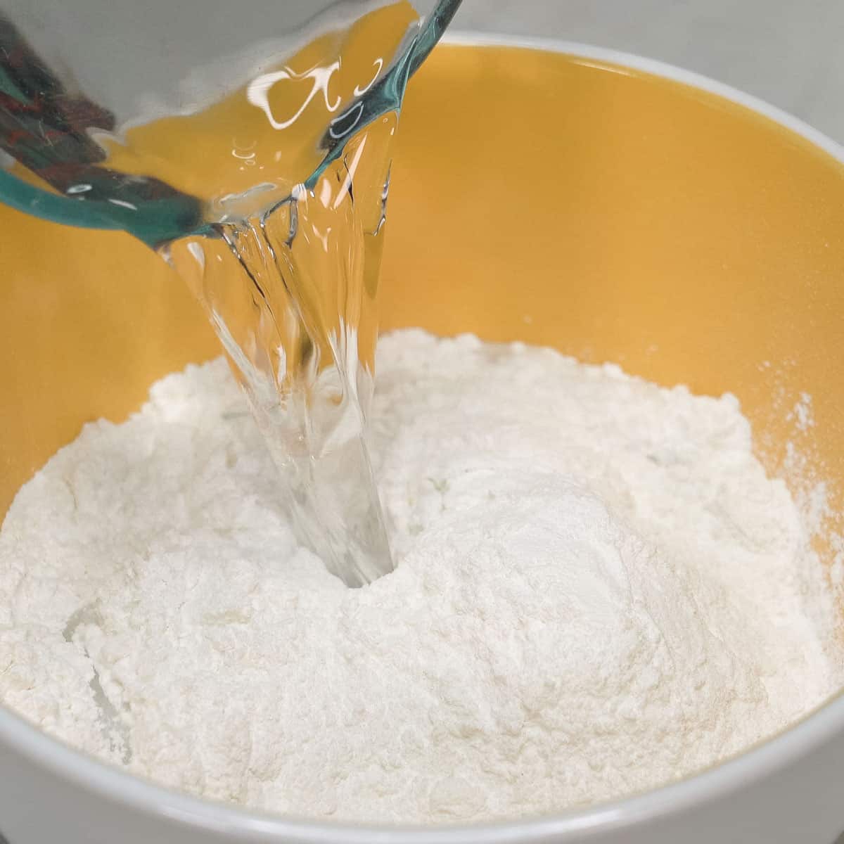 combining 2 cups glutinous rice flour, 1 cup water, and a pinch of salt.