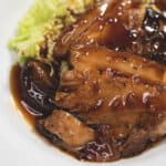 Pork asado on a plate.