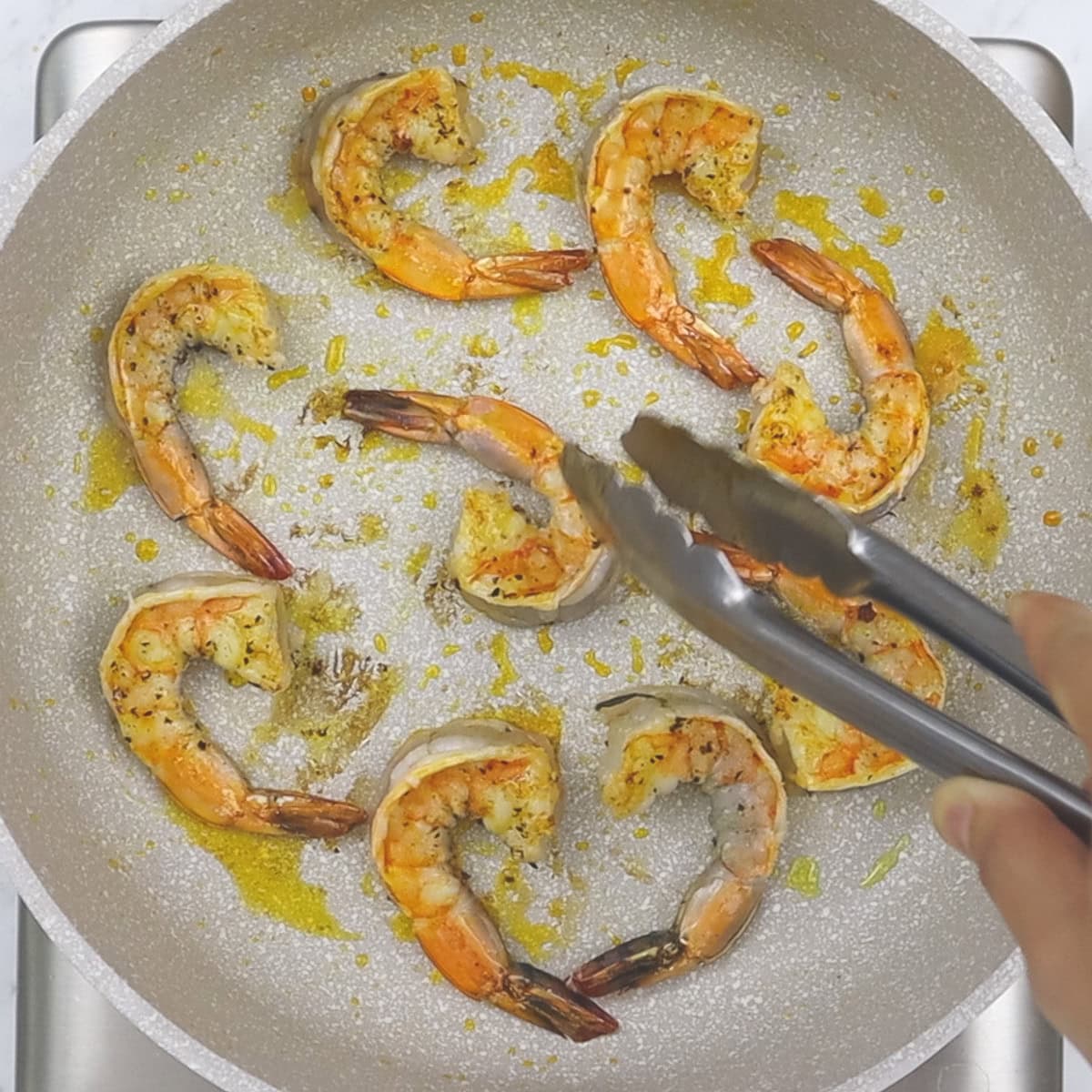 Searing the shrimp in the pan