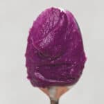 Ube halaya purple yam jam on a spoon.