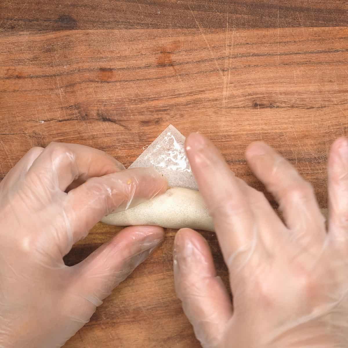 sealing the corner with water.
