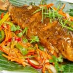 Filipino Escabeche Sweet and Sour Fish on a banana leaf.