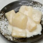 Ginataang kamoteng kahoy cassava in coconut milk on a plate.