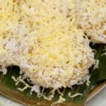 Pichi Pichi Steamed Cassava Cakes topped with grated cheese.