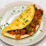 Tortang giniling with fluffy eggs on a plate.