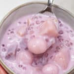 Ginataang Bilo Bilo in a bowl scooped by a spoon.