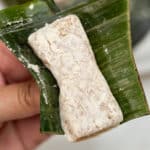 Holding Espasol with banana leaf.