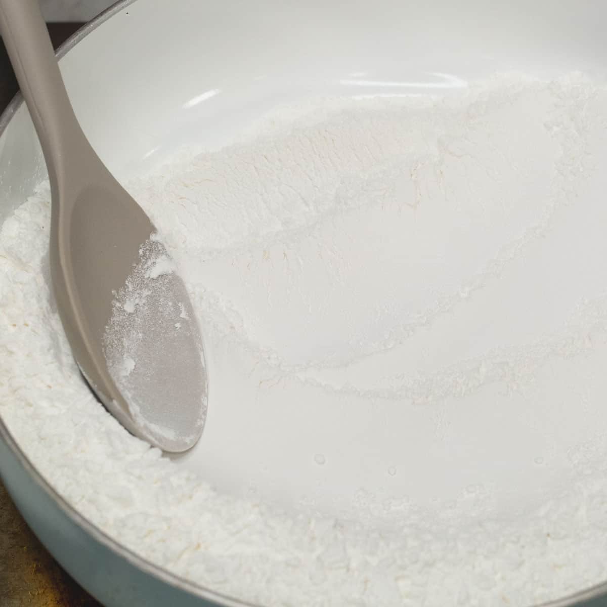 Toasting the glutinous rice flour in the pan.