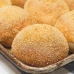 Pandesal on a baking tray.