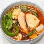 Sinigang na Salmon in a bowl.