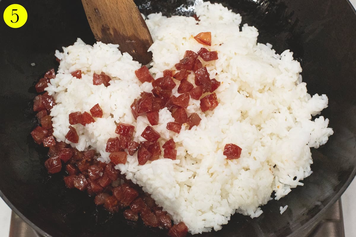 Added the white rice and Chinese sausage in the wok.