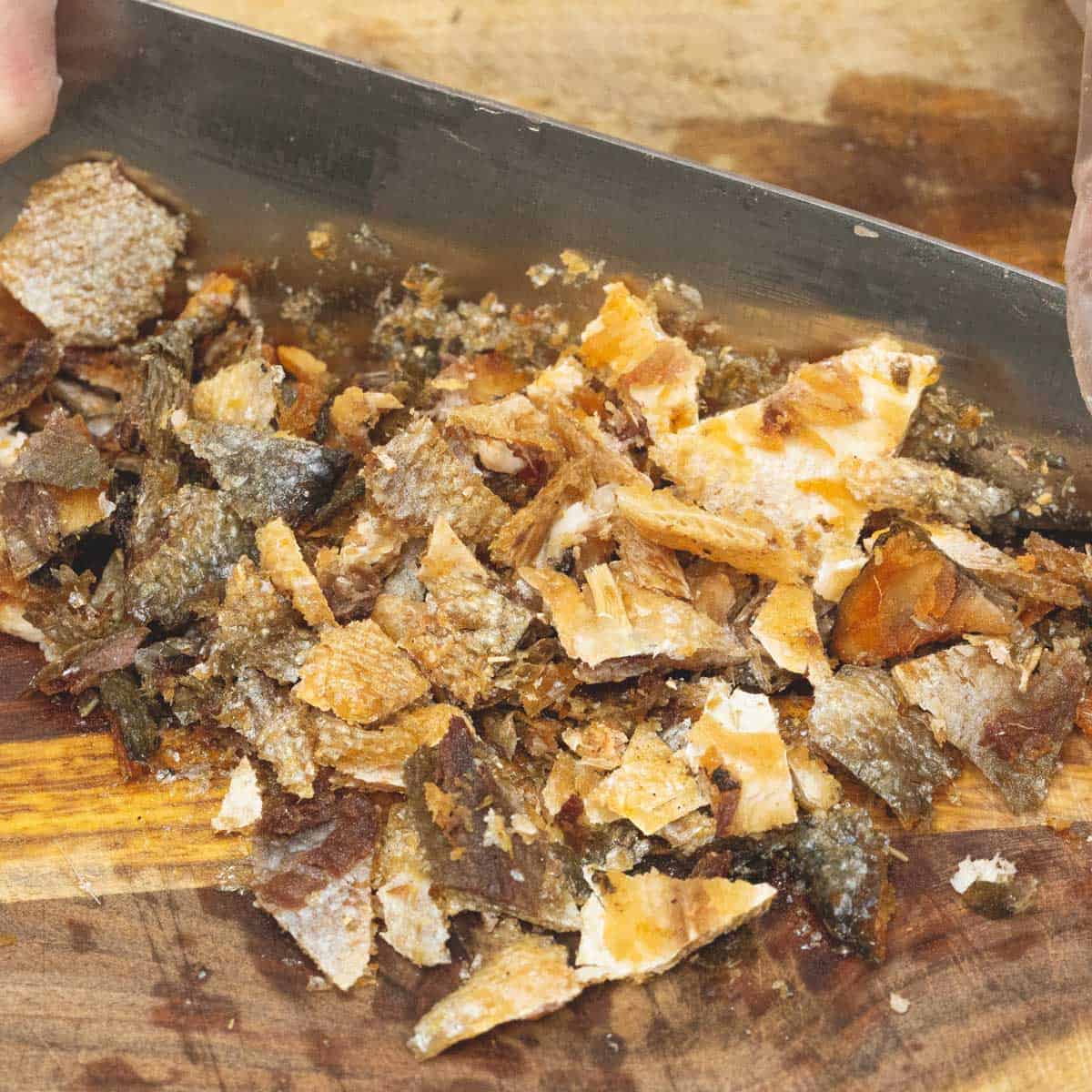 chopping the bangus skin