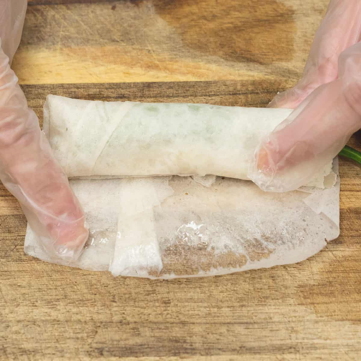Continue rolling until fully wrapped. Dab the edge with water to seal.
