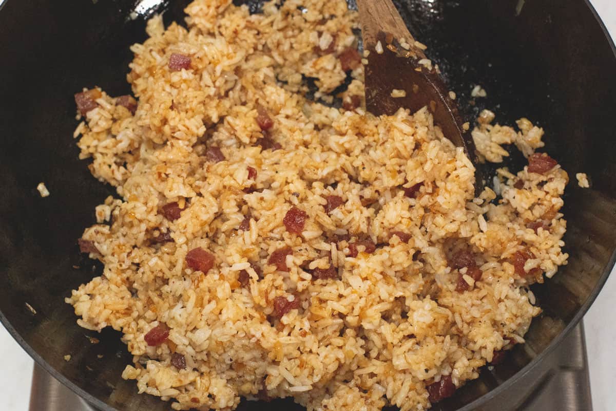 Tossing the Bagoong Fried Rice together in the wok.