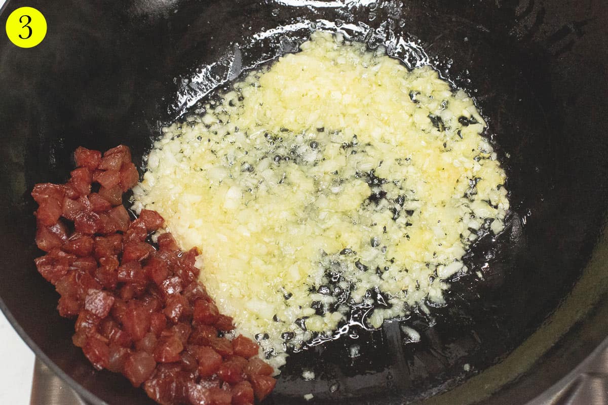 Sauteing the aromatics in the wok.