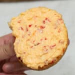 Holding Cheese Pimiento on a pandesal.