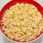 Macaroni Salad in a red bowl.