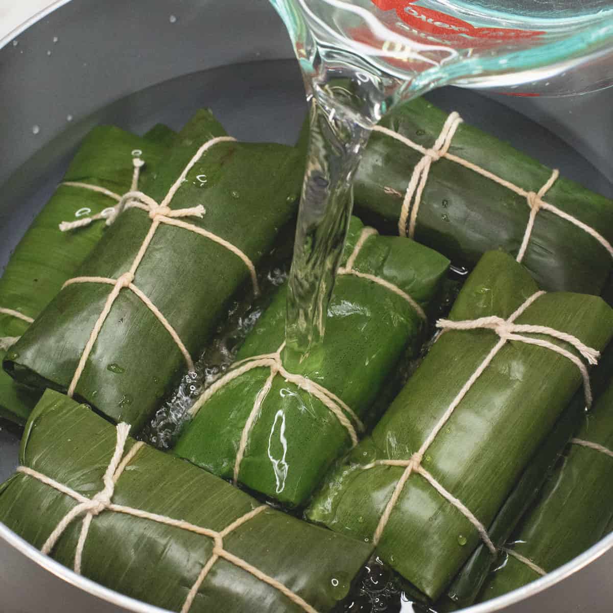 Boiling the suman submerged in water.