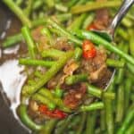 Adobong Sitaw on a cooking pan scooped by a spoon.