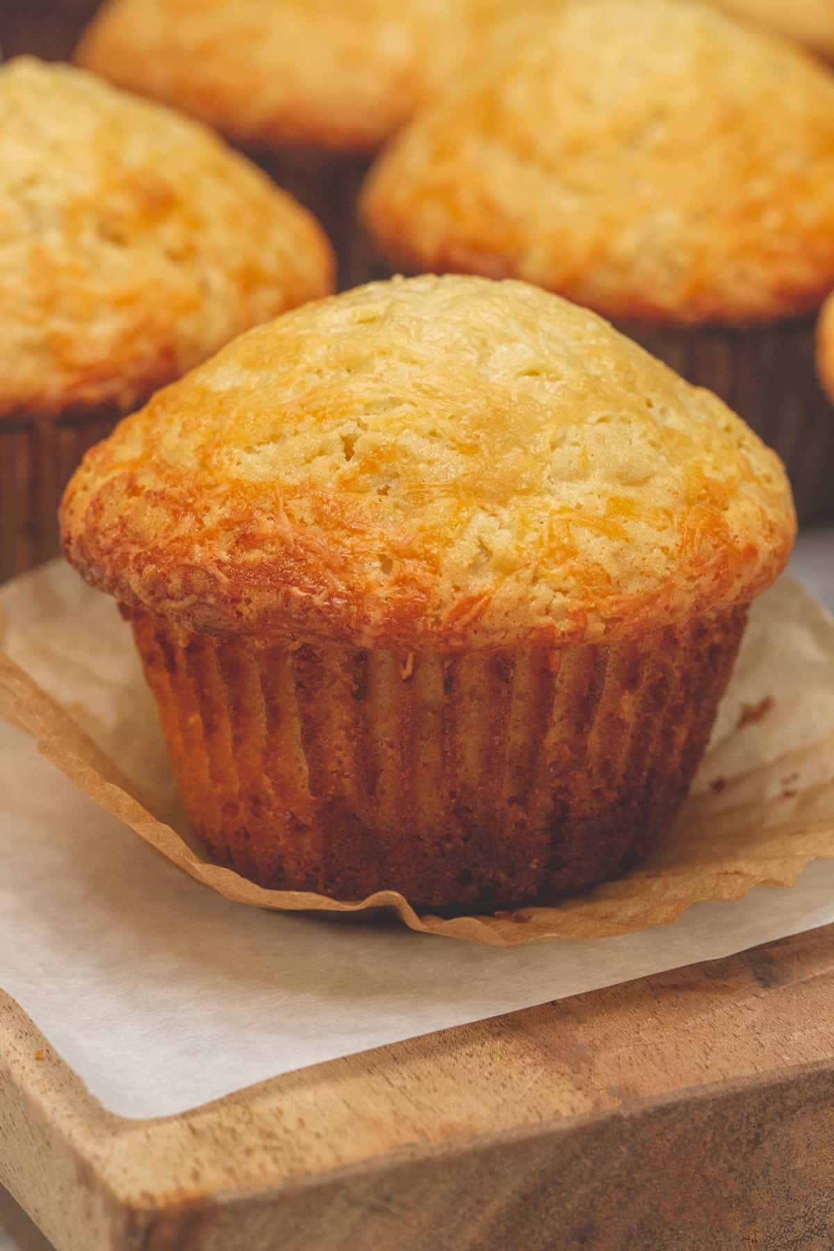 Baked Cheese Cupcakes on a cutting board.