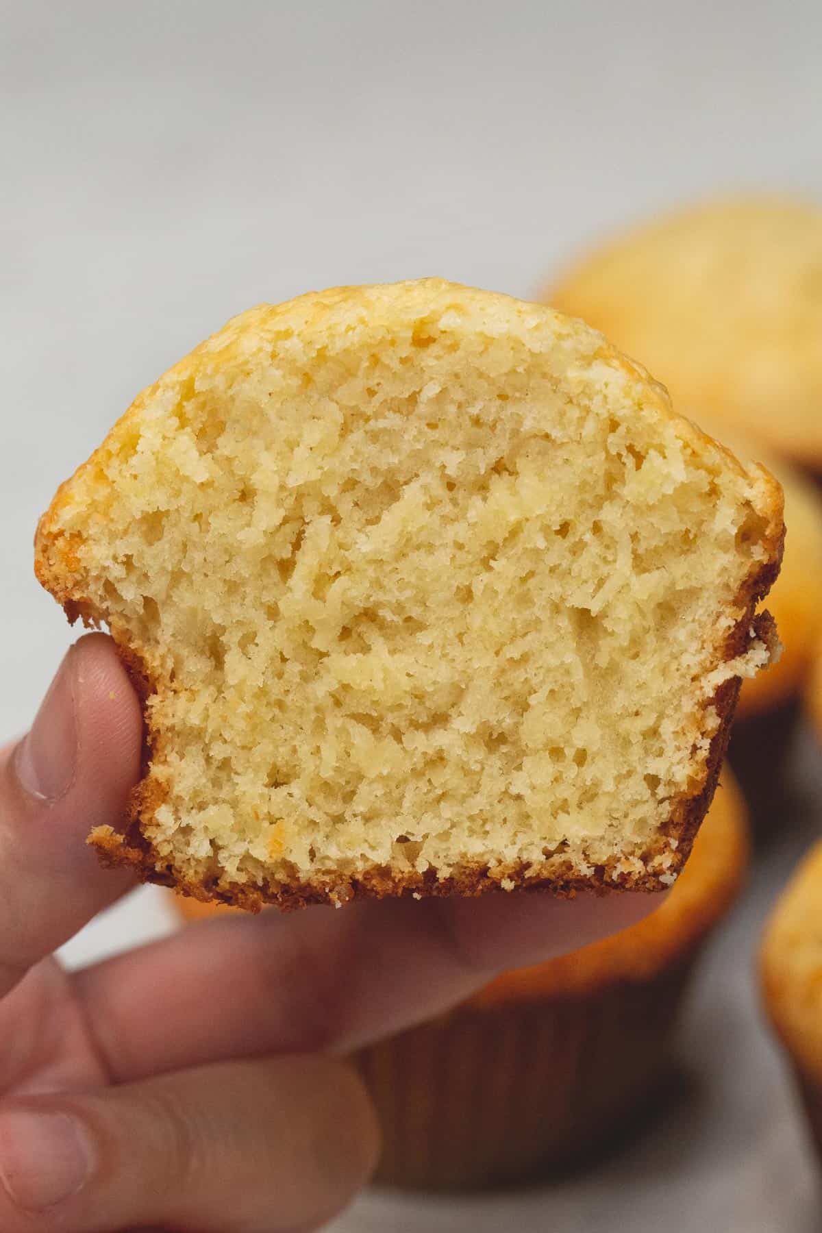 Holding a Cheese Cupcake cut in half.