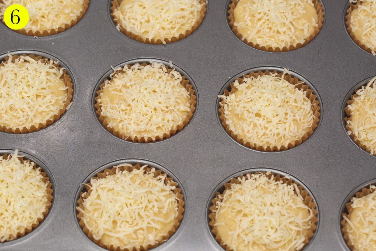 Filled the liners with the cupcake batter, then topped them with cheese.