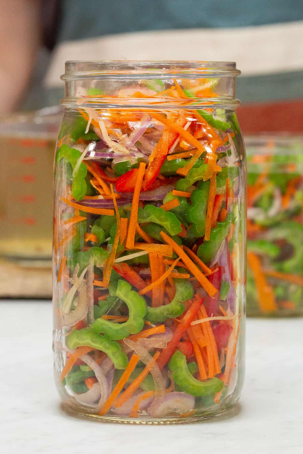 Packed vegetables in a mason jar.