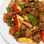 Pork and mushroom stir fry on a plate.