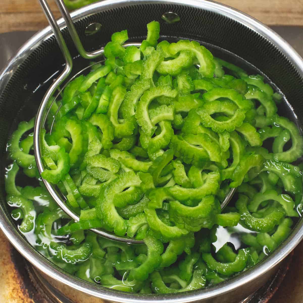 Blanching the ampalaya slices