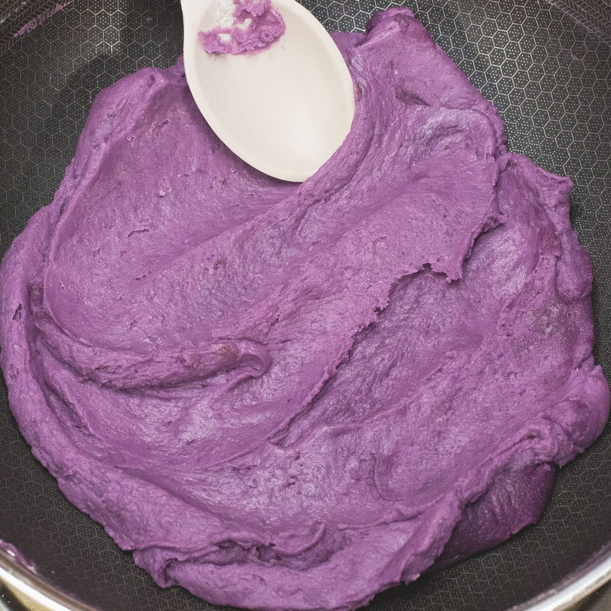 folding the dough in the wok