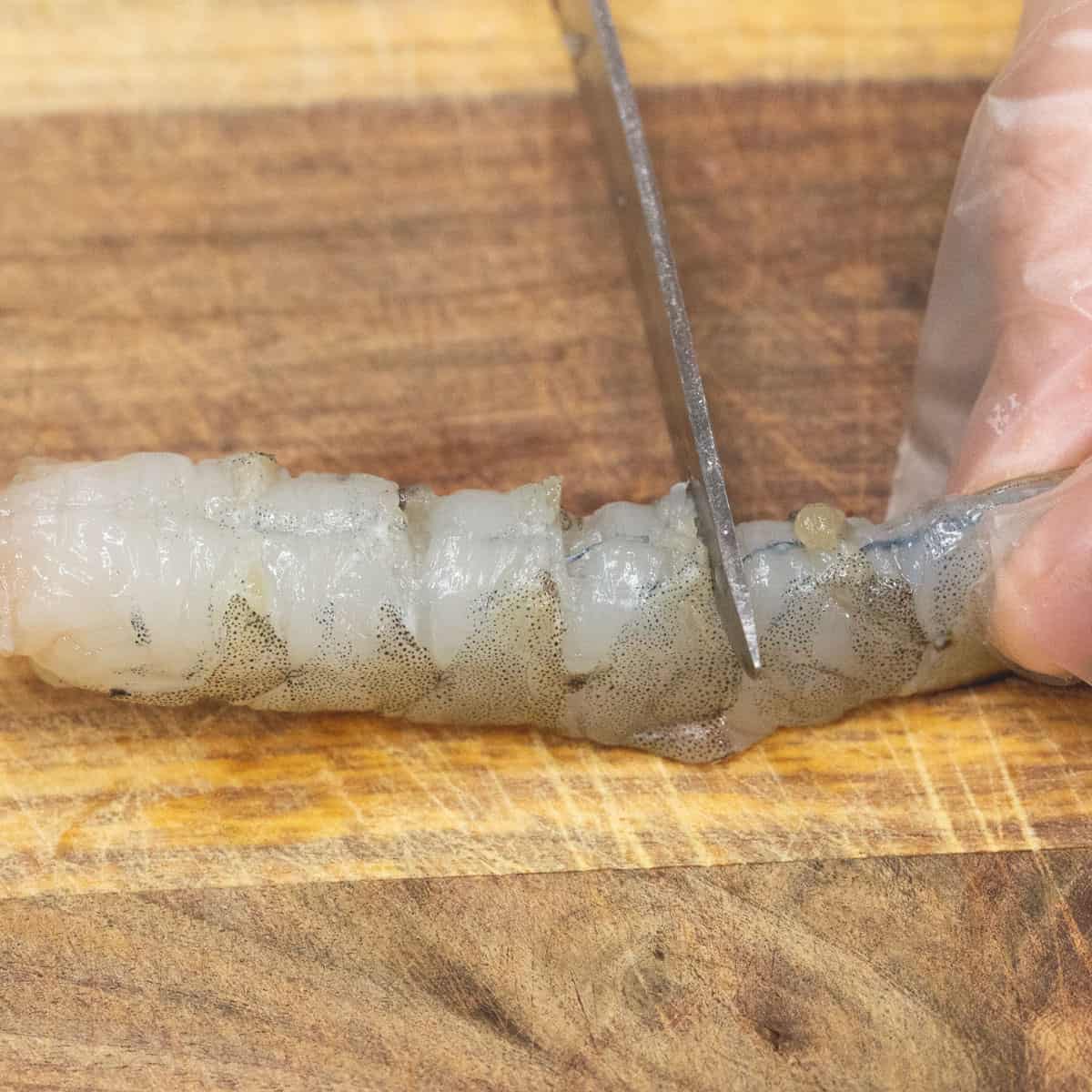 making shallow cuts on the underside to flatten them.