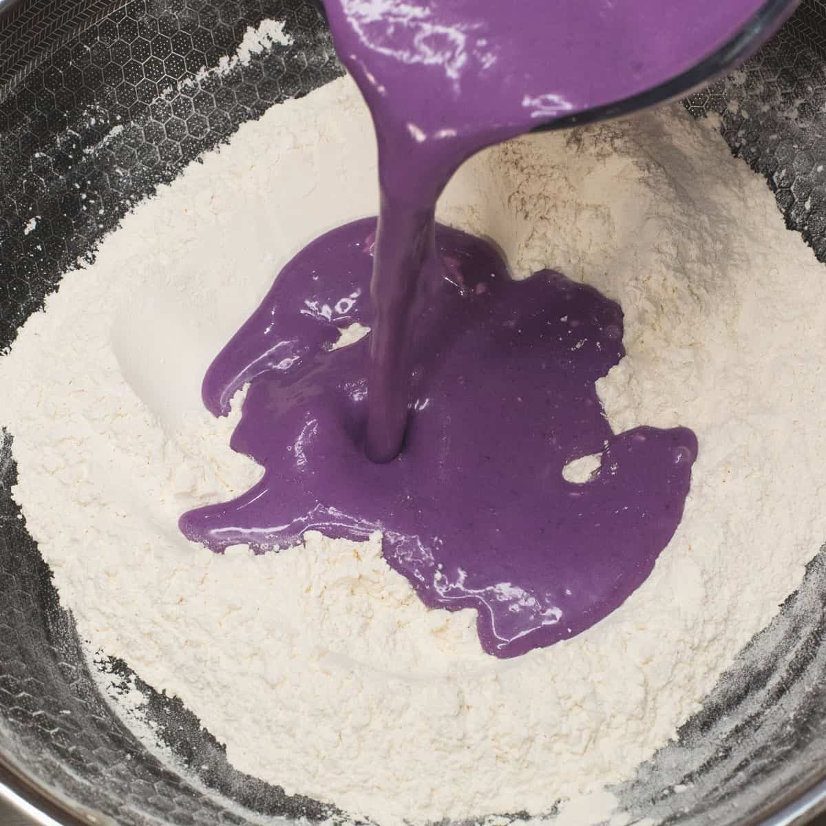 Pour the wet mixture into the pan with the toasted flour.