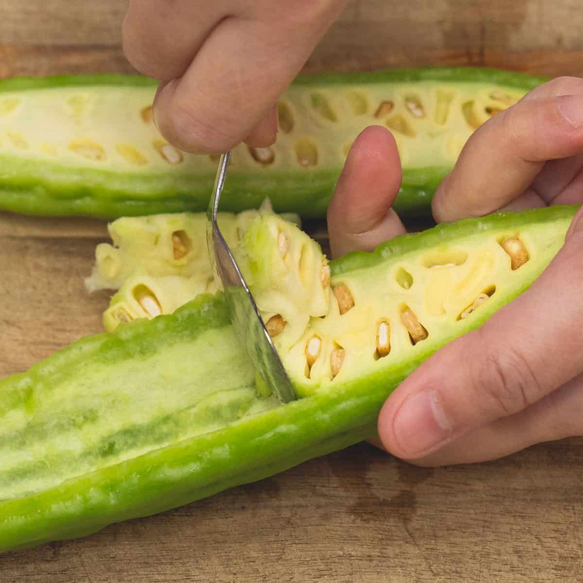 scrape out the seeds and white pith of the ampalaya