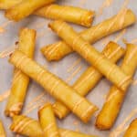 Cheese Lumpia drizzled with cheese sauce.