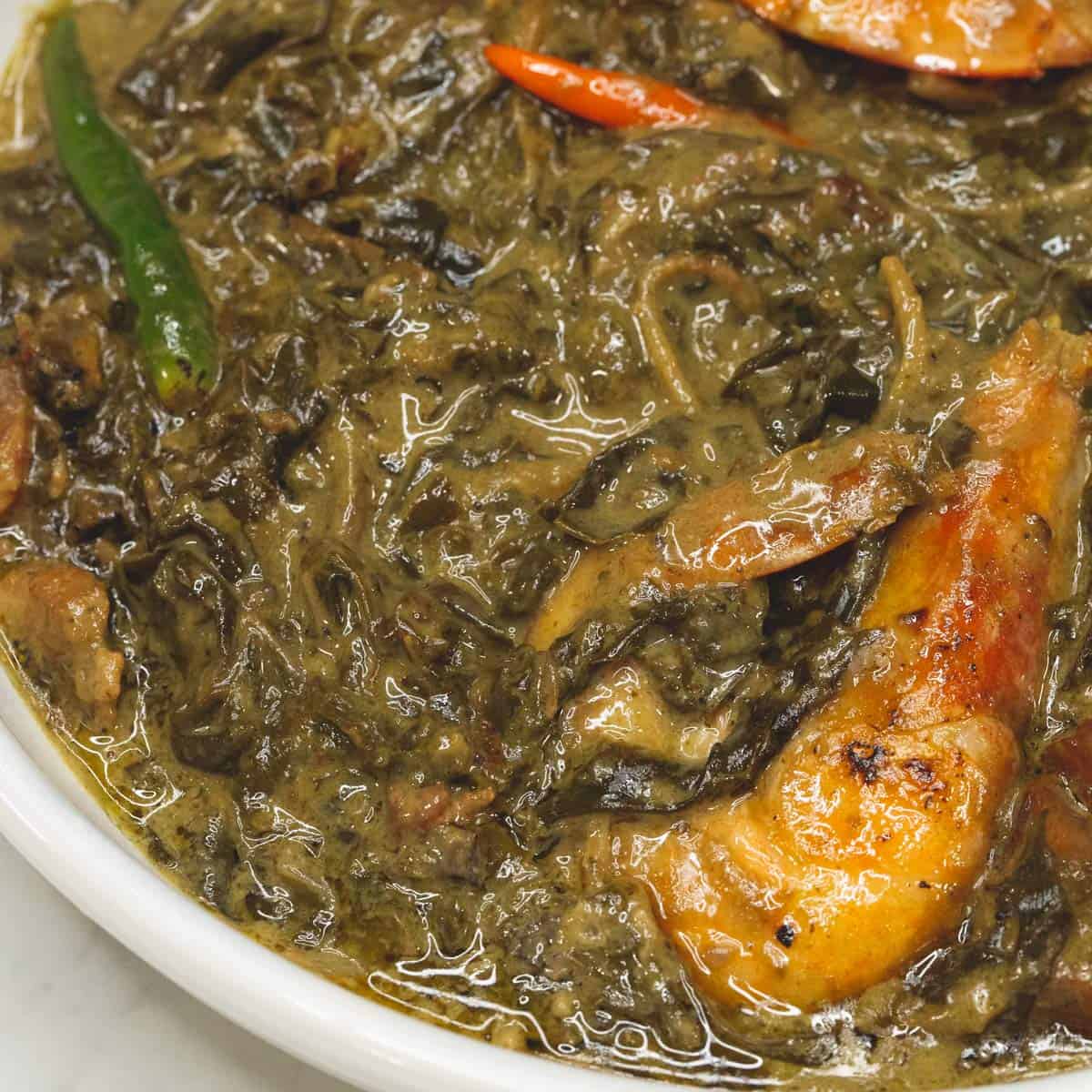 Laing with shrimp on a plate.