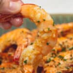 Holding a Peeled Garlic Butter Shrimp.