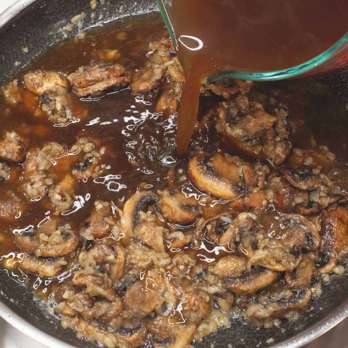 Adding the beef broth