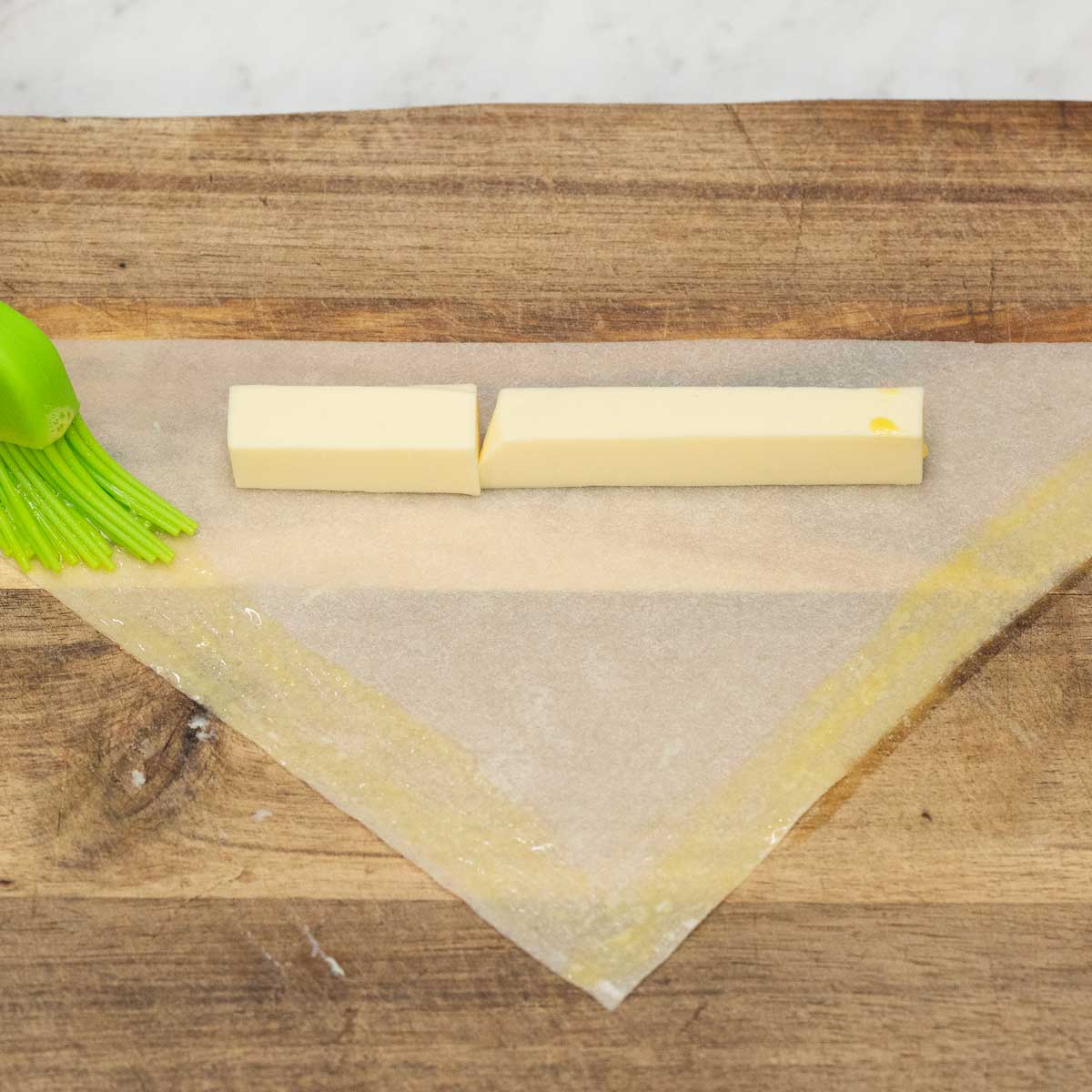 brushing the edges of cheese lumpia