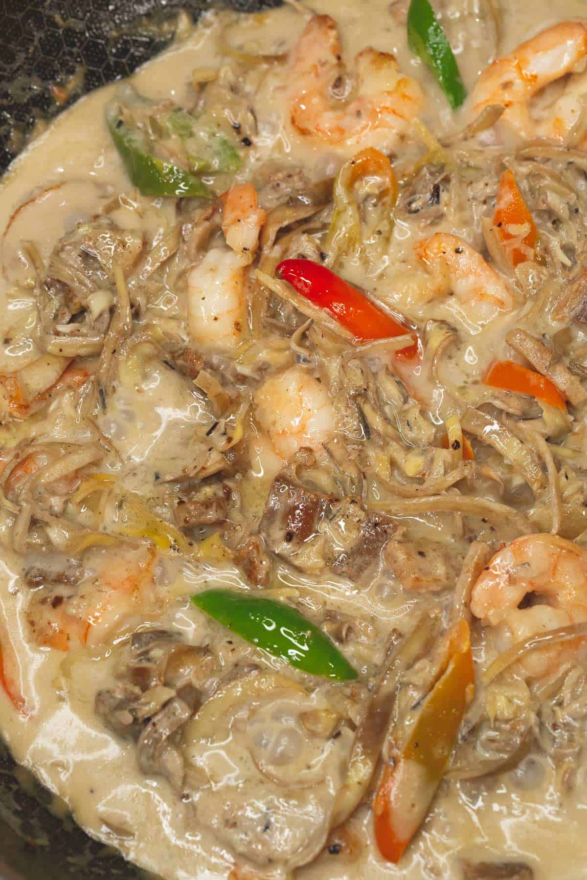 Cooked Ginataang Puso ng Saging in a wok.