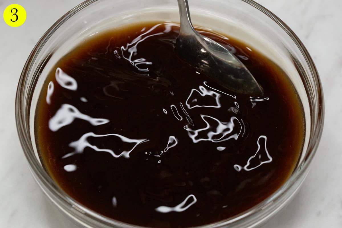 Mixing the adobo sauce in a bowl.