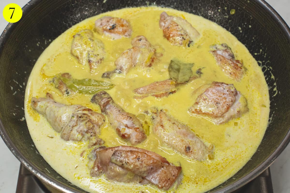 Simmering the mixture in the wok.