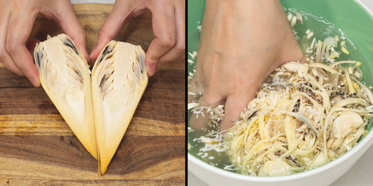 Inner core of the banana blossom cut in half, then sliced and submerged in water.