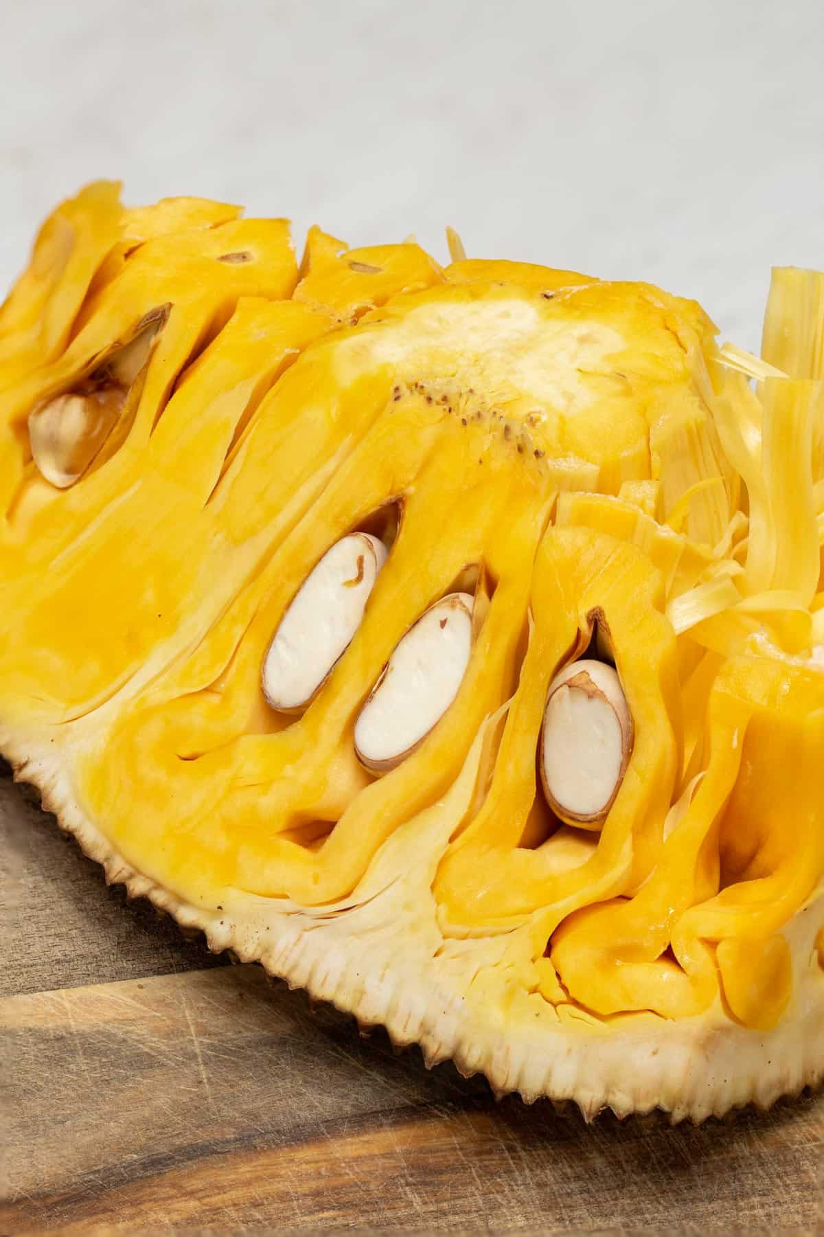 Cut ripe jackfruit on a board.